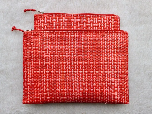 set of 3 hot pink and red raffia woven clutches with leather trim
