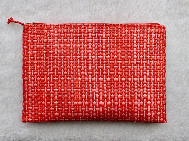 set of 3 hot pink and red raffia woven clutches with leather trim