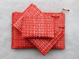 set of 3 hot pink and red raffia woven clutches with leather trim